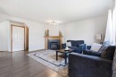 161 Saddlemead Road Ne, Calgary, AB  - Indoor Photo Showing Living Room With Fireplace 