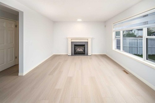 859 Harvest Hills Drive Ne, Calgary, AB - Indoor Photo Showing Living Room With Fireplace