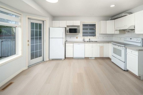 859 Harvest Hills Drive Ne, Calgary, AB - Indoor Photo Showing Kitchen With Double Sink