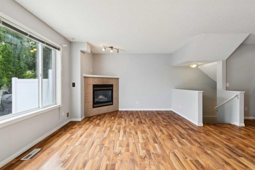 33 Chaparral Ridge Terrace Se, Calgary, AB - Indoor Photo Showing Living Room With Fireplace