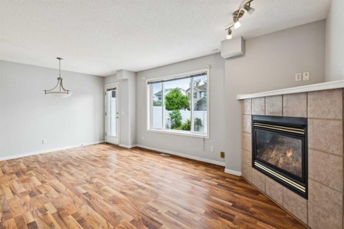 33 Chaparral Ridge Terrace Se, Calgary, AB - Indoor Photo Showing Living Room With Fireplace