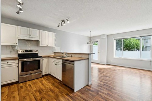 33 Chaparral Ridge Terrace Se, Calgary, AB - Indoor Photo Showing Kitchen With Double Sink