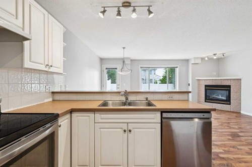33 Chaparral Ridge Terrace Se, Calgary, AB - Indoor Photo Showing Kitchen With Double Sink