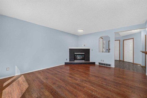 446 Harvest Hills Drive Ne, Calgary, AB - Indoor Photo Showing Living Room With Fireplace