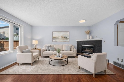 446 Harvest Hills Drive Ne, Calgary, AB - Indoor Photo Showing Living Room With Fireplace