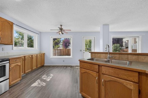 446 Harvest Hills Drive Ne, Calgary, AB - Indoor Photo Showing Kitchen With Double Sink