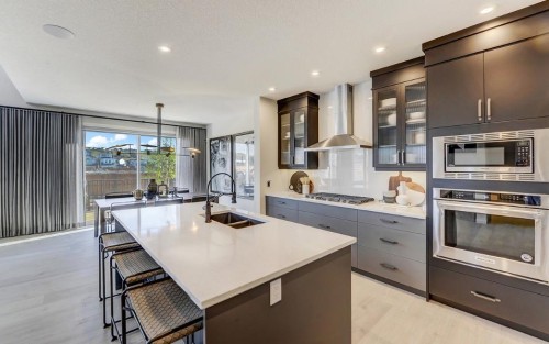 525 Lucas Way Nw, Calgary, AB - Indoor Photo Showing Kitchen With Double Sink With Upgraded Kitchen