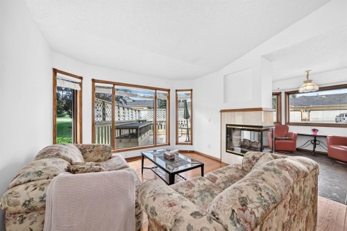 8 Sunlake Close Se, Calgary, AB - Indoor Photo Showing Living Room With Fireplace