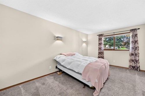 8 Sunlake Close Se, Calgary, AB - Indoor Photo Showing Bedroom