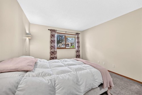 8 Sunlake Close Se, Calgary, AB - Indoor Photo Showing Bedroom