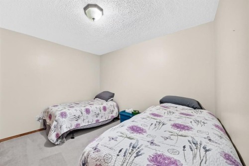 8 Sunlake Close Se, Calgary, AB - Indoor Photo Showing Bedroom