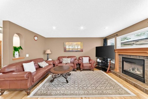 144 Cougarstone Common Sw, Calgary, AB - Indoor With Fireplace