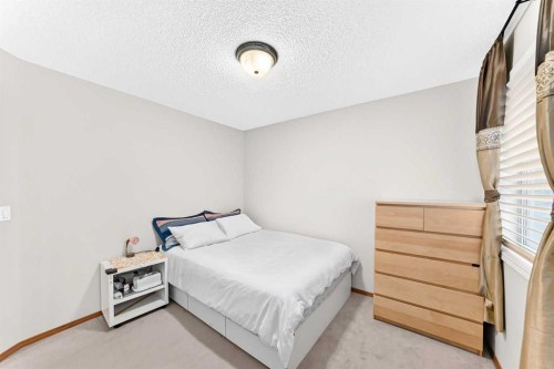 144 Cougarstone Common Sw, Calgary, AB - Indoor Photo Showing Bedroom