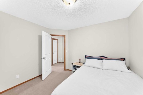 144 Cougarstone Common Sw, Calgary, AB - Indoor Photo Showing Bedroom