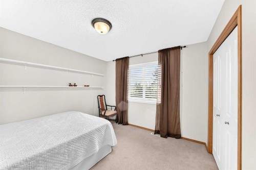 144 Cougarstone Common Sw, Calgary, AB - Indoor Photo Showing Bedroom