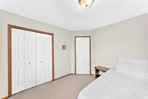 144 Cougarstone Common Sw, Calgary, AB - Indoor Photo Showing Bedroom