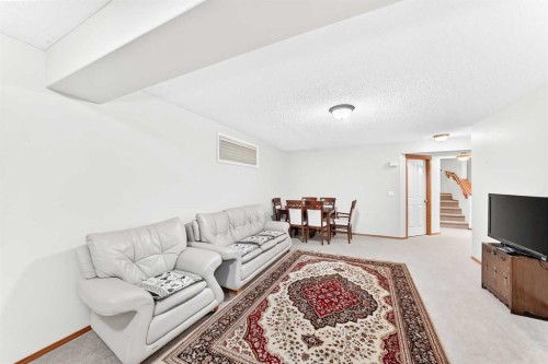 144 Cougarstone Common Sw, Calgary, AB - Indoor Photo Showing Living Room