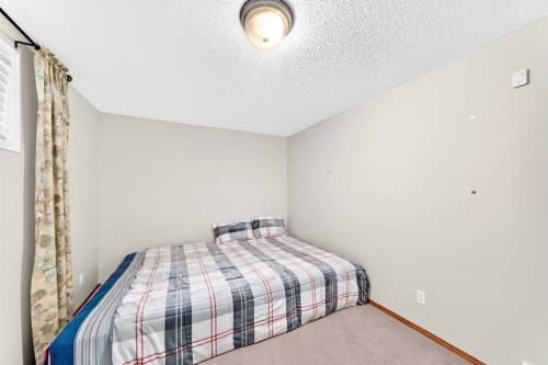 144 Cougarstone Common Sw, Calgary, AB - Indoor Photo Showing Bedroom