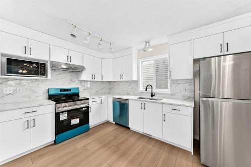 94 Arbour Wood Mews Nw, Calgary, AB - Indoor Photo Showing Kitchen With Upgraded Kitchen
