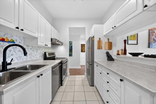 2410-202 Braeglen Close Sw, Calgary, AB - Indoor Photo Showing Kitchen With Double Sink