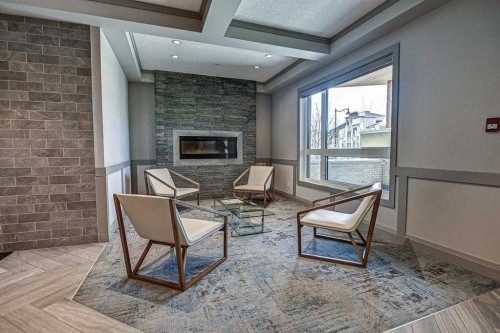 401-145 Burma Star Road Sw, Calgary, AB - Indoor With Fireplace