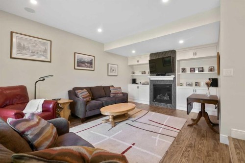 315 Woodpark Place Sw, Calgary, AB - Indoor Photo Showing Living Room With Fireplace