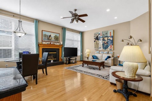 44 Strathlea Close Sw, Calgary, AB - Indoor Photo Showing Living Room With Fireplace