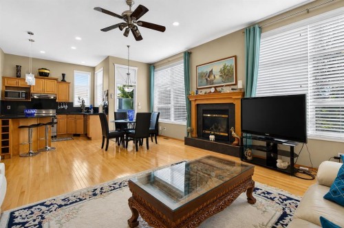 44 Strathlea Close Sw, Calgary, AB - Indoor With Fireplace