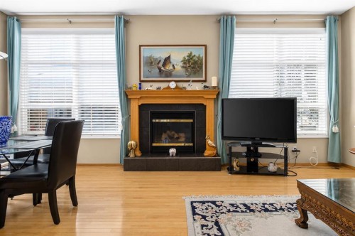 44 Strathlea Close Sw, Calgary, AB - Indoor Photo Showing Living Room With Fireplace