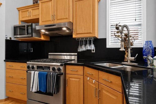 44 Strathlea Close Sw, Calgary, AB - Indoor Photo Showing Kitchen With Double Sink