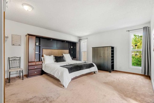 84 Deermoss Crescent Se, Calgary, AB - Indoor Photo Showing Bedroom