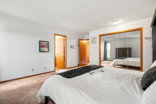 84 Deermoss Crescent Se, Calgary, AB - Indoor Photo Showing Bedroom