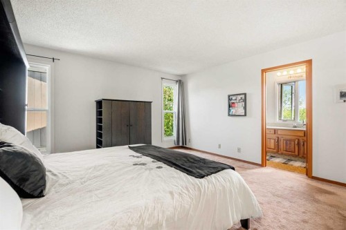 84 Deermoss Crescent Se, Calgary, AB - Indoor Photo Showing Bedroom