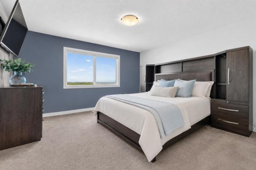 61 Hanson Lane Ne, Langdon, AB - Indoor Photo Showing Bedroom