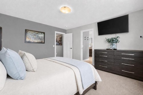 61 Hanson Lane Ne, Langdon, AB - Indoor Photo Showing Bedroom