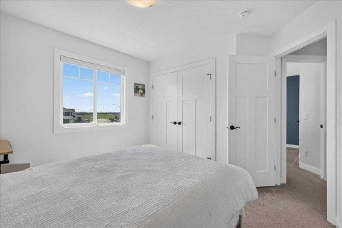 61 Hanson Lane Ne, Langdon, AB - Indoor Photo Showing Bedroom