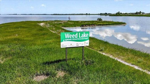 61 Hanson Lane Ne, Langdon, AB - Outdoor With Body Of Water With View