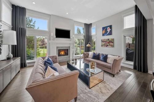 656 Quarry Way Se, Calgary, AB - Indoor Photo Showing Living Room With Fireplace