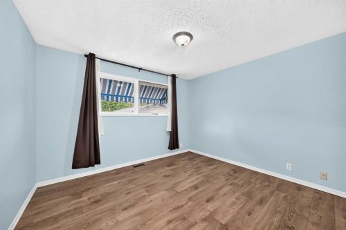 19 Falshire Drive Ne, Calgary, AB - Indoor Photo Showing Other Room