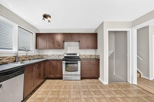 19 Falshire Drive Ne, Calgary, AB - Indoor Photo Showing Kitchen With Double Sink