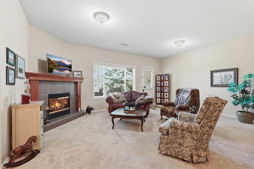 120 Sierra Morena Landing Sw, Calgary, AB - Indoor Photo Showing Living Room With Fireplace