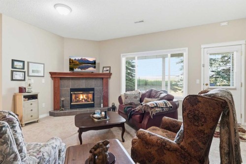 120 Sierra Morena Landing Sw, Calgary, AB - Indoor Photo Showing Living Room With Fireplace