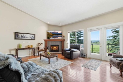 120 Sierra Morena Landing Sw, Calgary, AB - Indoor Photo Showing Living Room With Fireplace