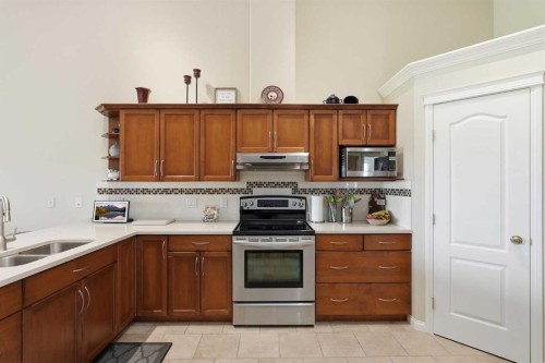 120 Sierra Morena Landing Sw, Calgary, AB - Indoor Photo Showing Kitchen With Double Sink