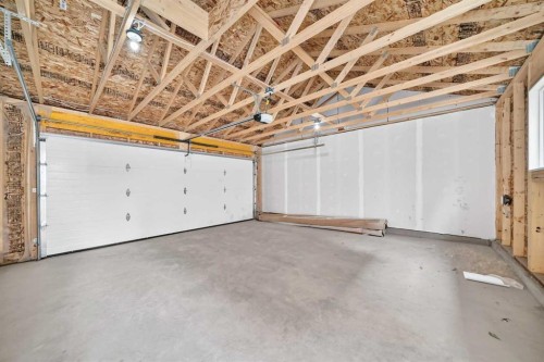 97 Herron Mews Ne, Calgary, AB - Indoor Photo Showing Garage