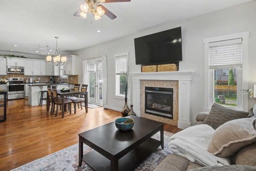 2 Baywater Cape, Airdrie, AB - Indoor Photo Showing Living Room With Fireplace