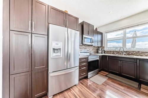 33 Redstone Drive Ne, Calgary, AB - Indoor Photo Showing Kitchen With Upgraded Kitchen