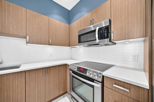 202-10 Auburn Bay Link Se, Calgary, AB - Indoor Photo Showing Kitchen