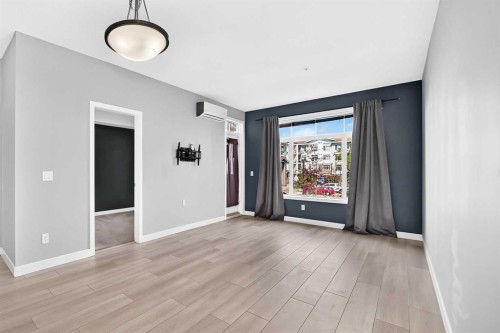 202-10 Auburn Bay Link Se, Calgary, AB - Indoor Photo Showing Other Room