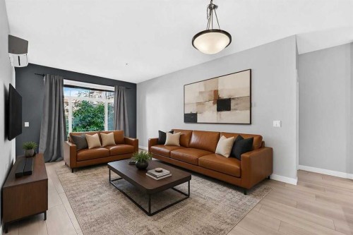 202-10 Auburn Bay Link Se, Calgary, AB - Indoor Photo Showing Living Room